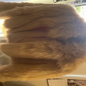 A faux fur great for night time going out dressy jacket.